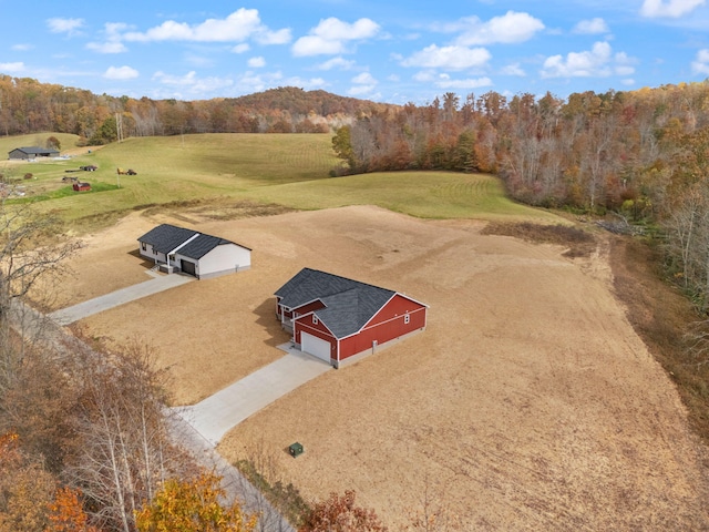 bird's eye view featuring a forest view