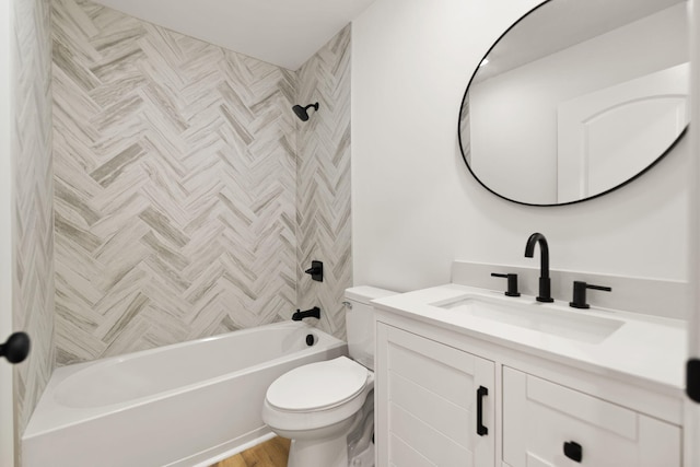 bathroom with shower / washtub combination, vanity, and toilet