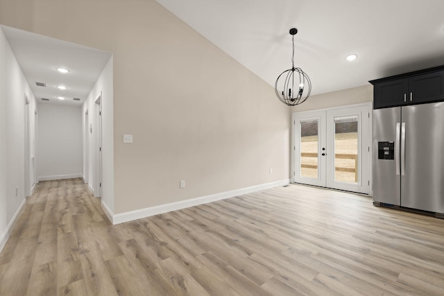 interior space with light wood-style flooring, a notable chandelier, recessed lighting, baseboards, and french doors