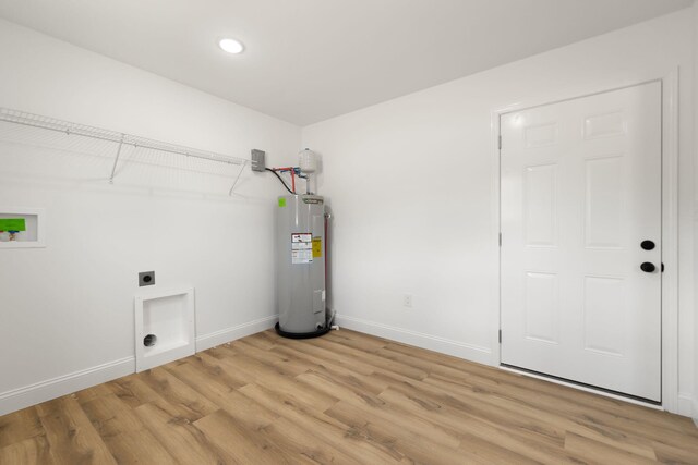 utility room with electric water heater