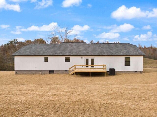 rear view of house featuring crawl space, roof with shingles, a wooden deck, and french doors