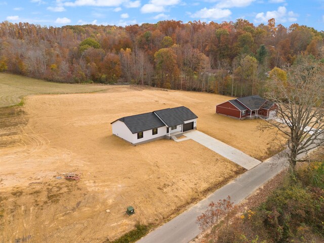 bird's eye view with a rural view and a view of trees