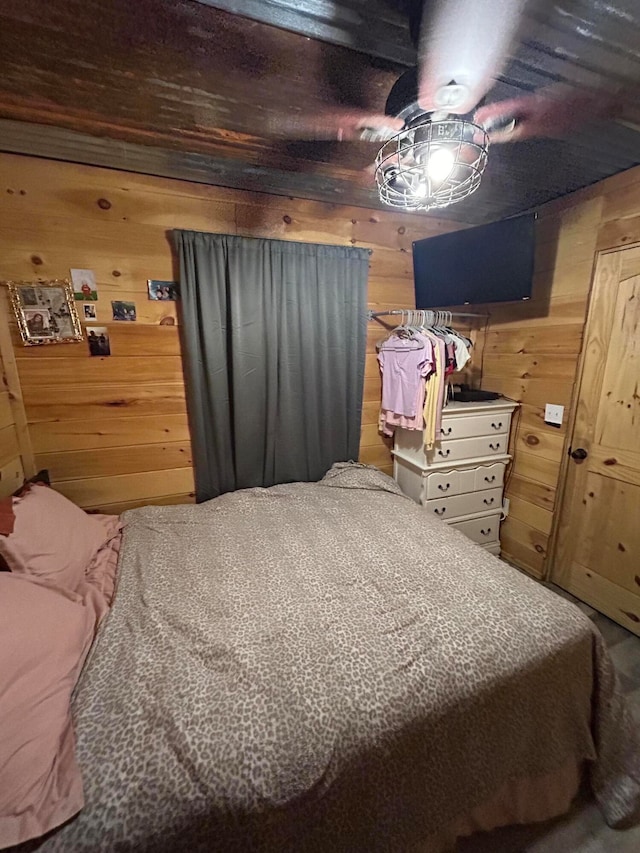 bedroom with wood walls