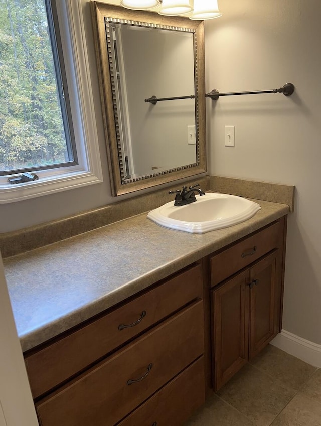 bathroom with tile patterned flooring and vanity