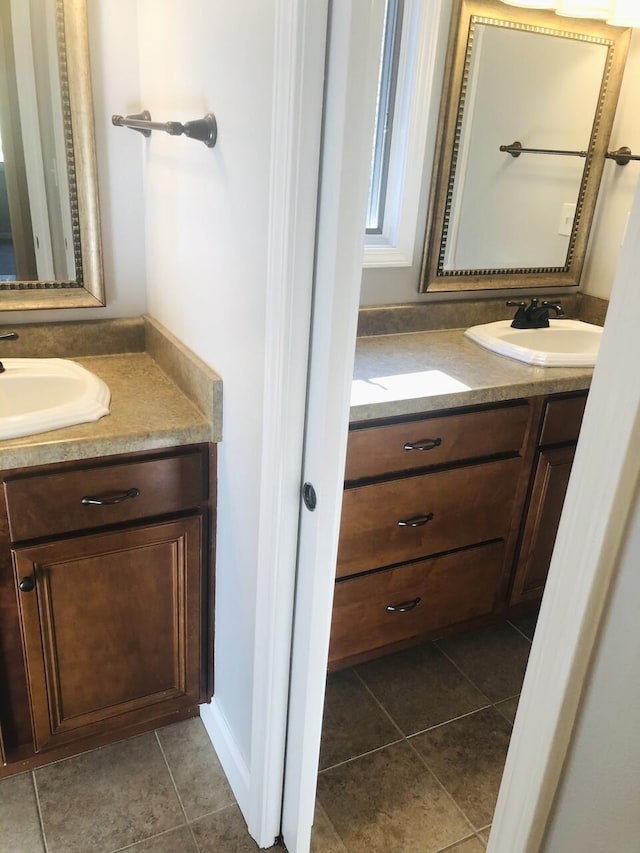 bathroom with tile patterned flooring and vanity