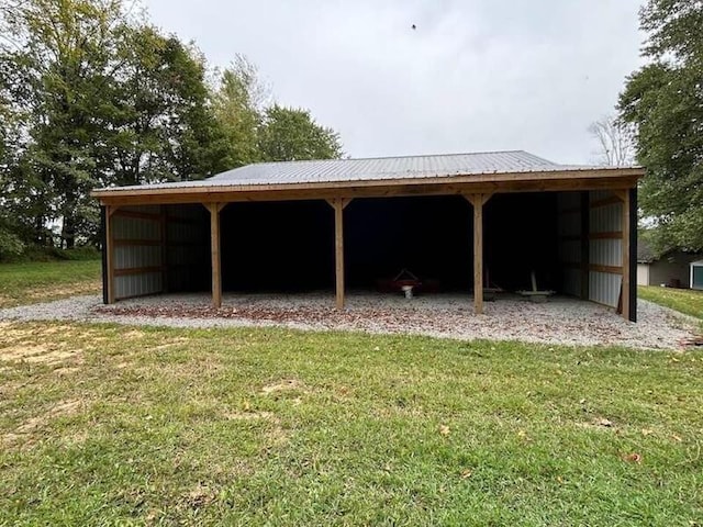 view of outbuilding featuring a lawn