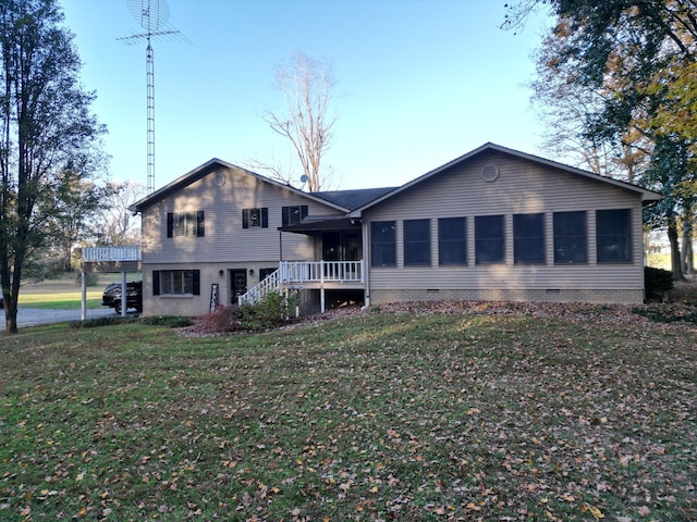 back of house with a yard