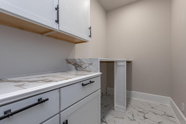 2528 Leland Ln, Lexington, KY 40503 - laundry room with light marble finish flooring and baseboards