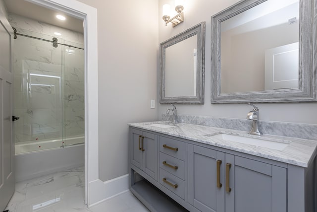 bathroom with vanity and enclosed tub / shower combo