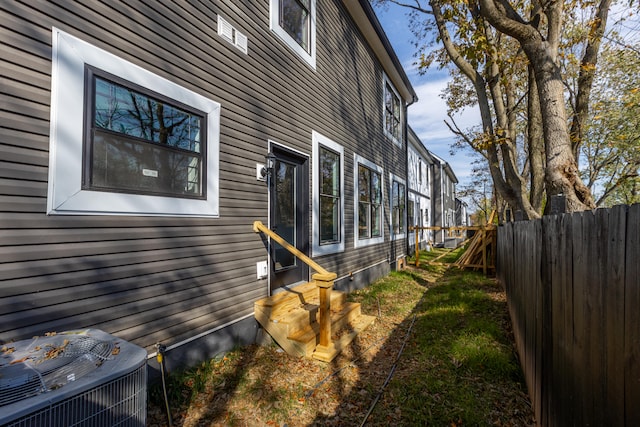 view of side of property with central AC unit