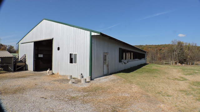 view of outdoor structure featuring a lawn