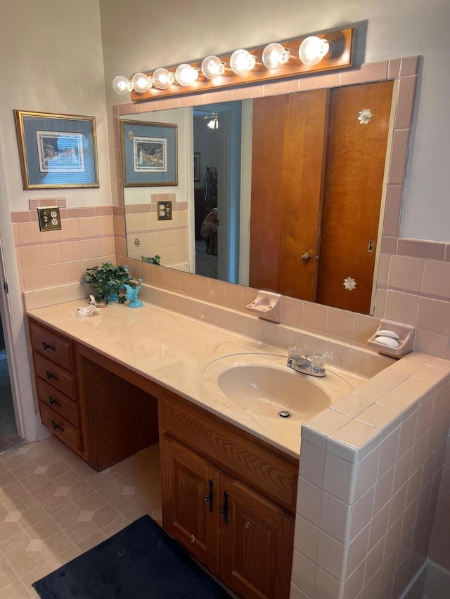 bathroom featuring tile patterned flooring and vanity