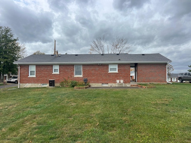 back of house with a yard