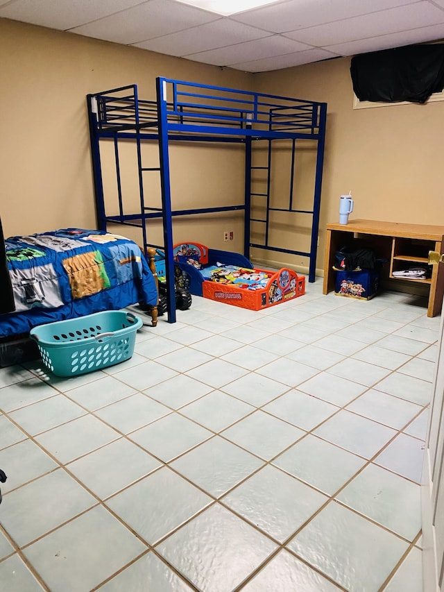 tiled bedroom with a drop ceiling