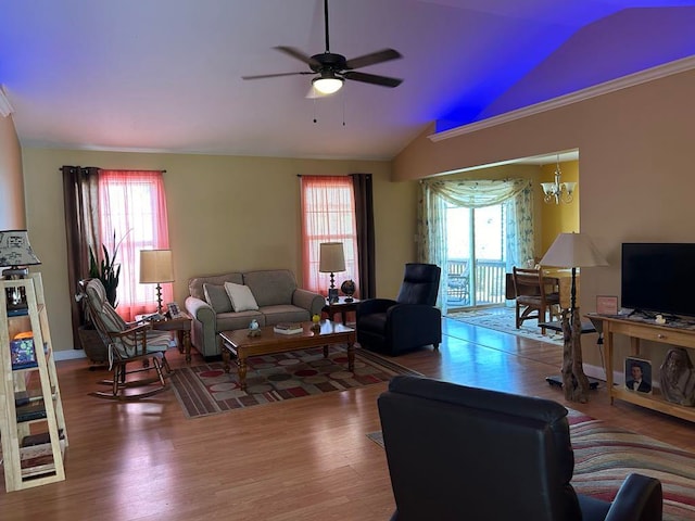 living room with lofted ceiling, hardwood / wood-style floors, and ceiling fan with notable chandelier