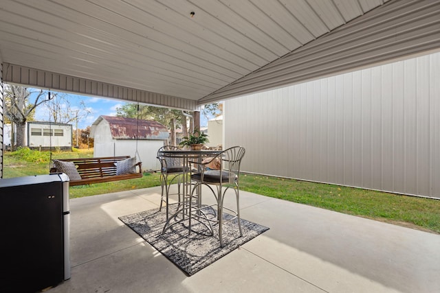 view of patio featuring a shed