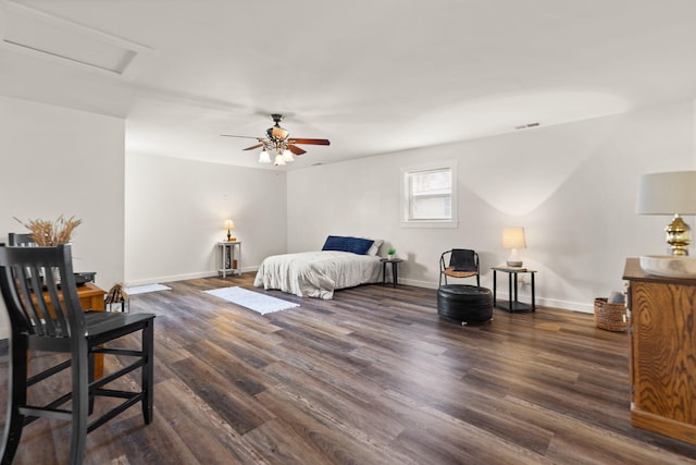 bedroom with dark wood-type flooring and ceiling fan