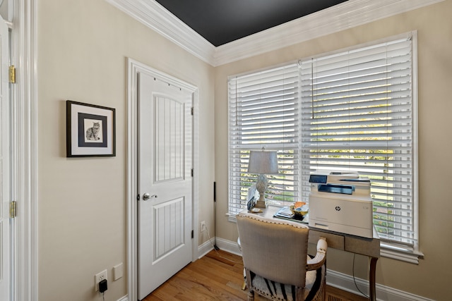 office area featuring hardwood / wood-style floors and ornamental molding