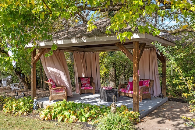 view of outbuilding featuring outdoor lounge area and a gazebo