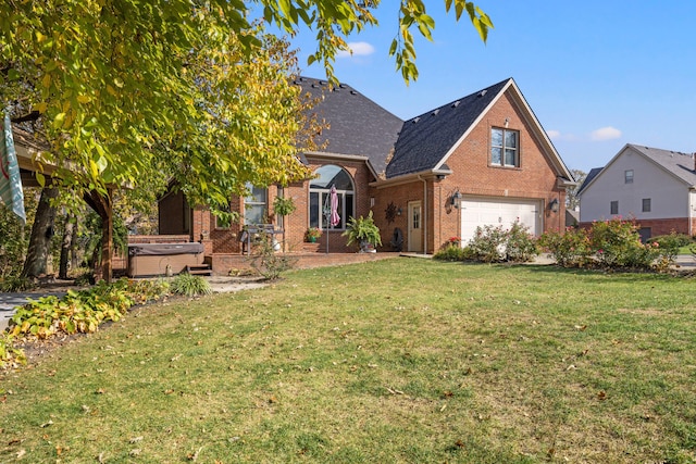 front facade featuring a front yard, a hot tub, and a garage