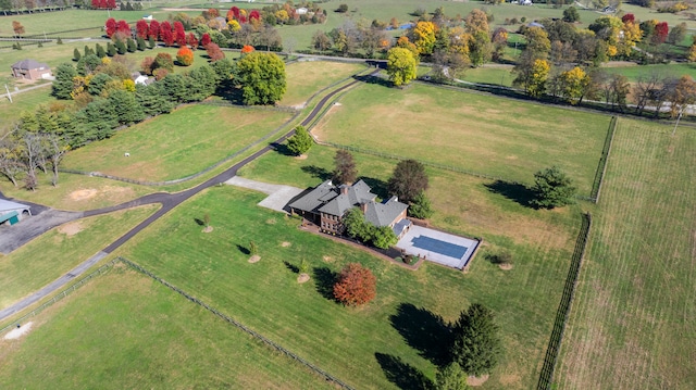 birds eye view of property with a rural view