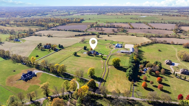 birds eye view of property featuring a rural view