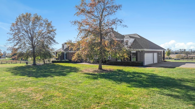 view of front of home featuring a garage and a front lawn