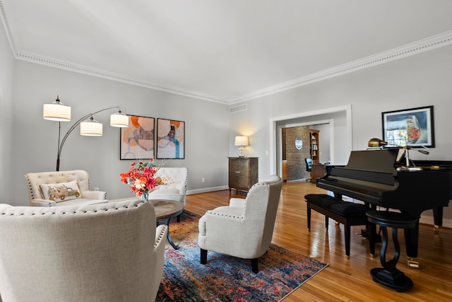 living room featuring wood-type flooring and ornamental molding