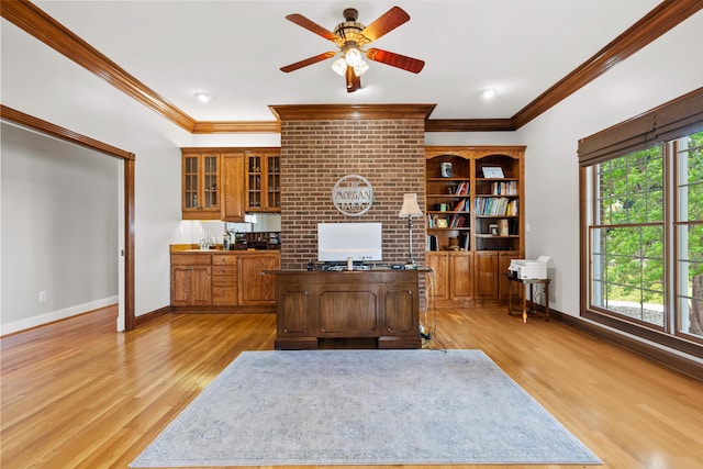 home office featuring light hardwood / wood-style floors, crown molding, a wealth of natural light, and ceiling fan