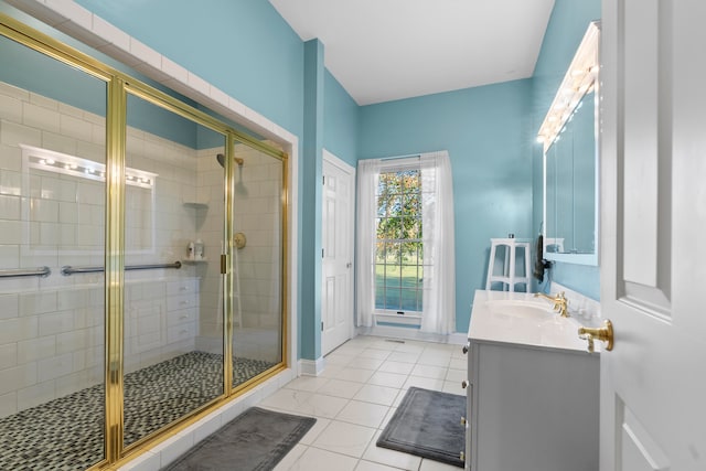 bathroom with vanity, tile patterned floors, and a shower with shower door