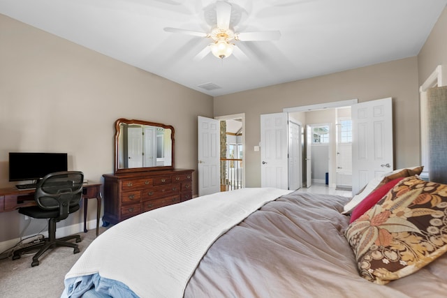 bedroom featuring light colored carpet and ceiling fan