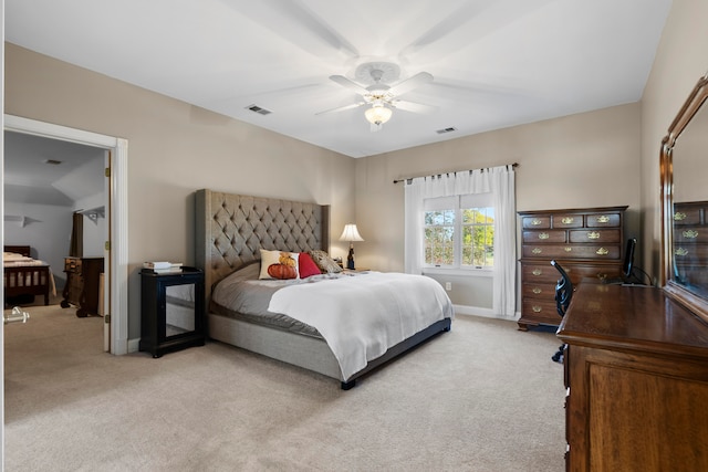 bedroom with ceiling fan and light colored carpet