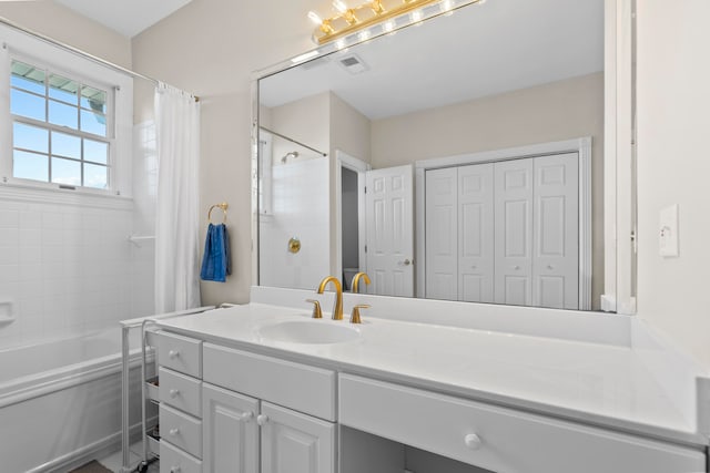 bathroom with vanity and shower / tub combo