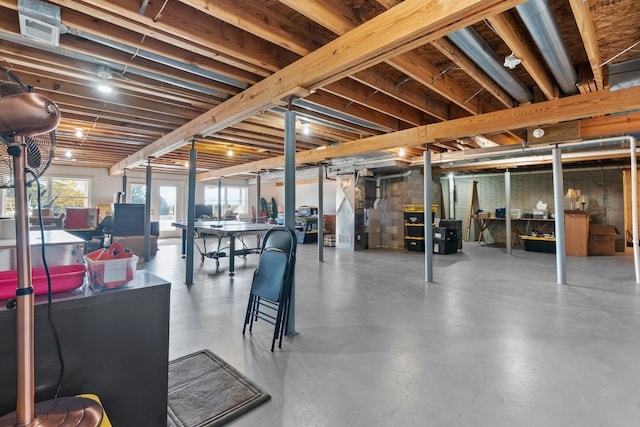 basement featuring heating unit