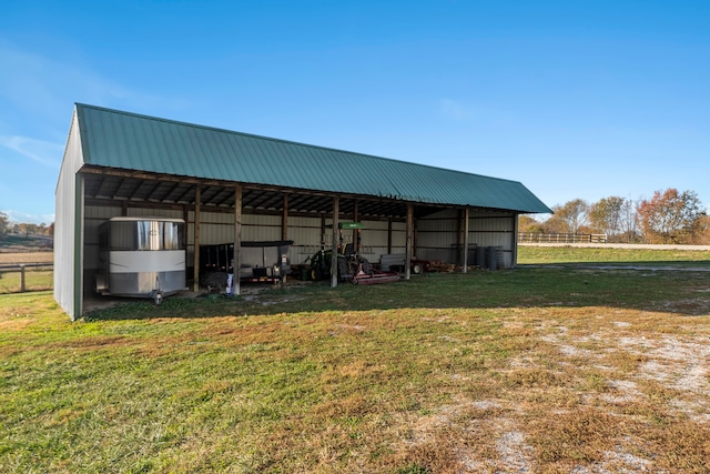 view of outbuilding featuring a yard