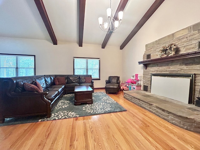 living room with hardwood / wood-style floors, a notable chandelier, and vaulted ceiling with beams