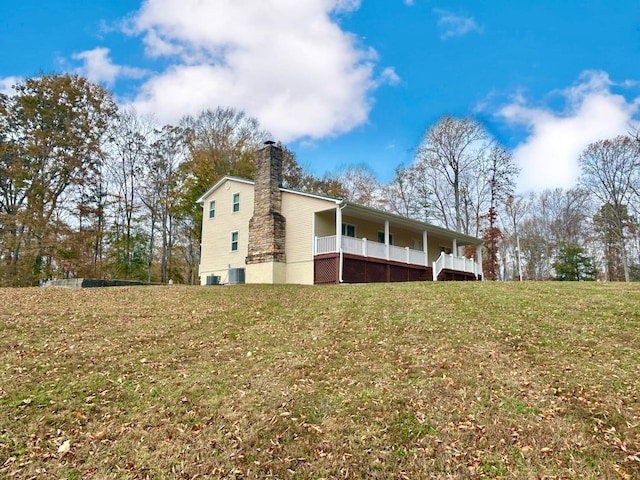 view of side of home featuring a yard