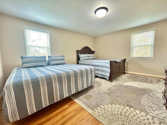 bedroom with hardwood / wood-style flooring