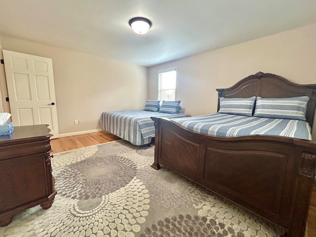 bedroom with light wood-type flooring