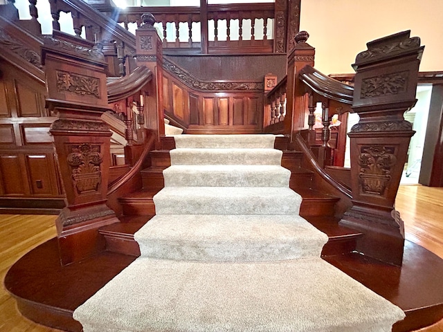 staircase featuring hardwood / wood-style floors