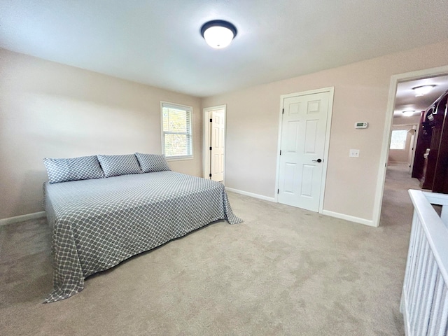 bedroom with light colored carpet