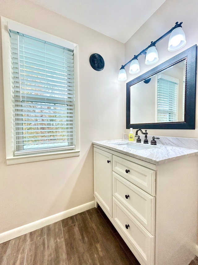 bathroom featuring vanity and hardwood / wood-style floors