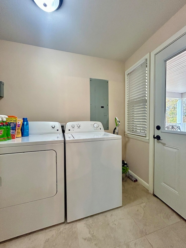 laundry room featuring electric panel and washing machine and dryer