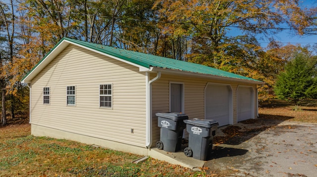 view of side of property with an outbuilding and a garage