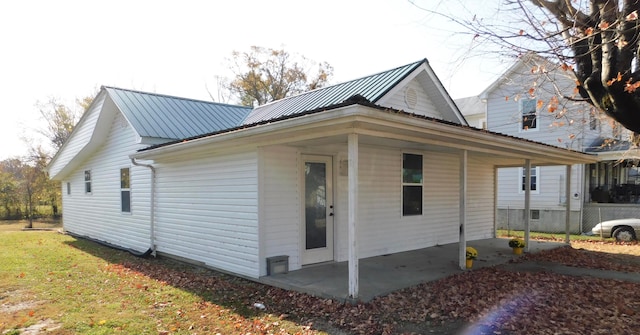 view of side of home with a patio area