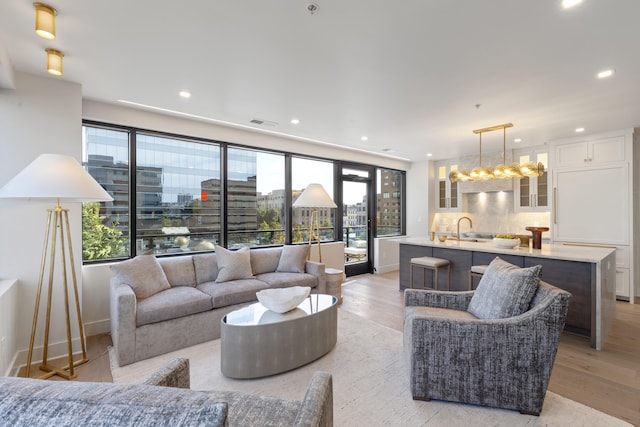 106 W Vine St Unit 407, Lexington, KY 40507 - living area with light wood-style floors, recessed lighting, and baseboards