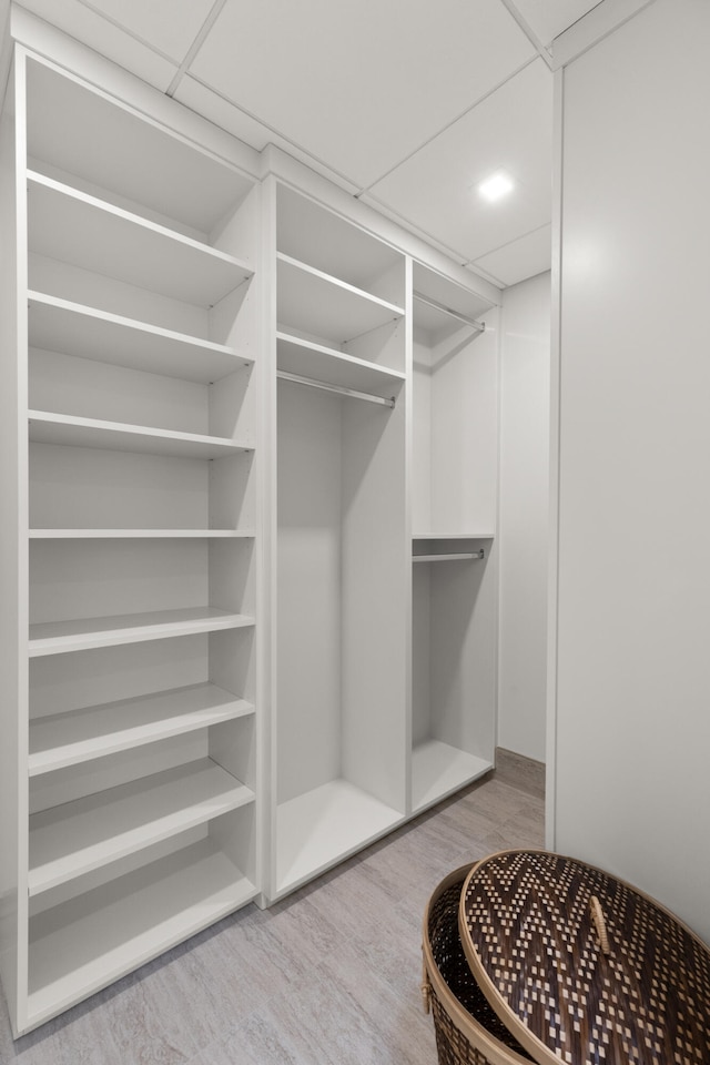 106 W Vine St Unit 407, Lexington, KY 40507 - walk in closet featuring wood finished floors
