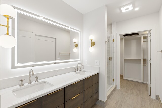 106 W Vine St Unit 407, Lexington, KY 40507 - full bath with wood finished floors, a stall shower, and double vanity