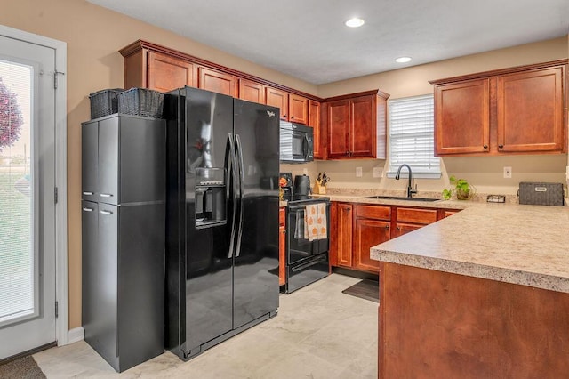 kitchen with sink and black appliances