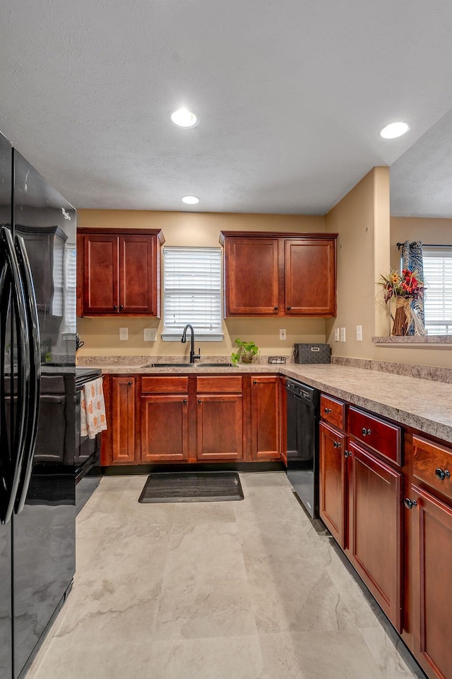 kitchen with sink and black appliances